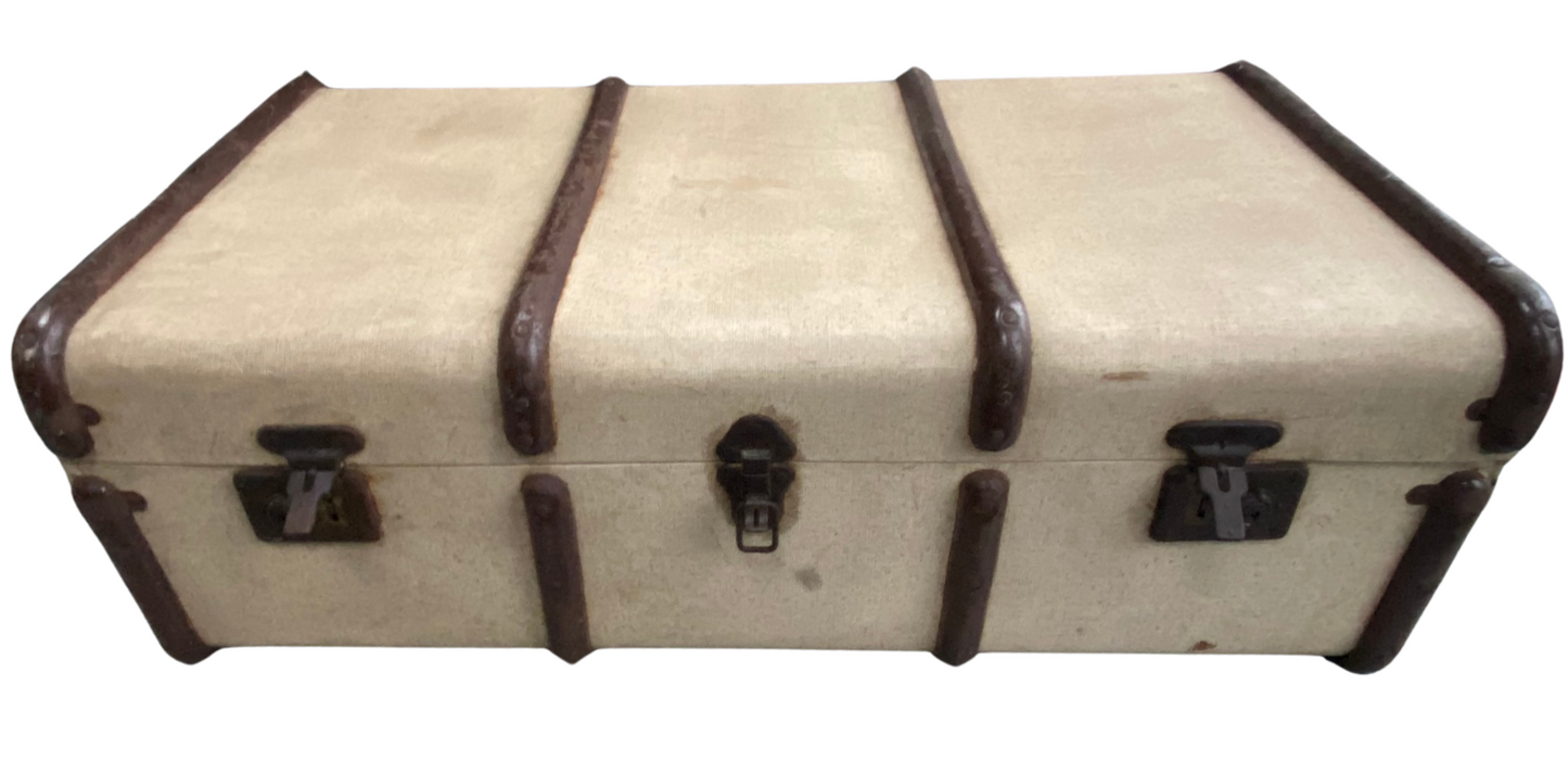 Cream and Brown steamer trunk with metal bands before its transformation
