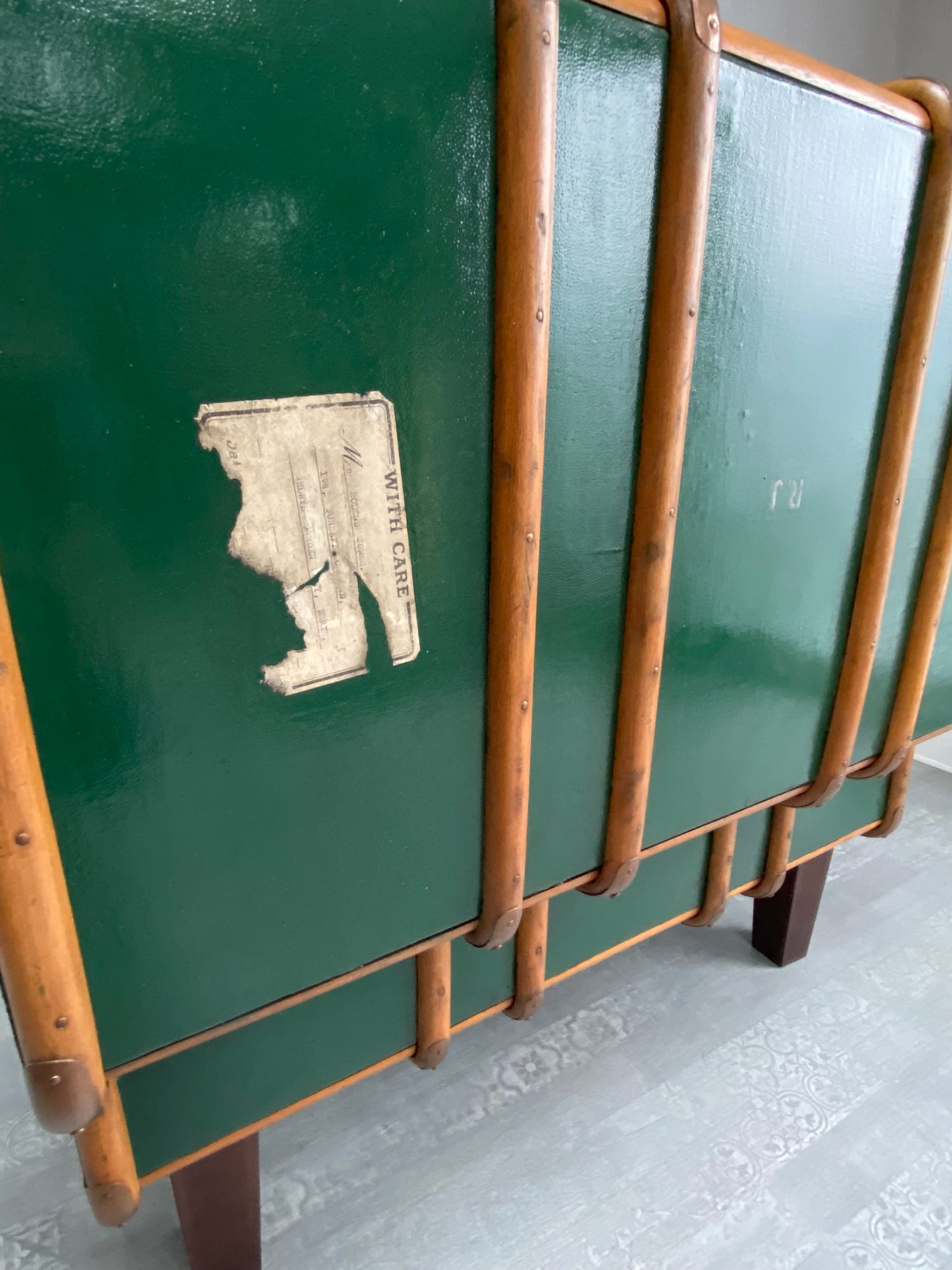 view of travel ticket on back of steamer trunk chair