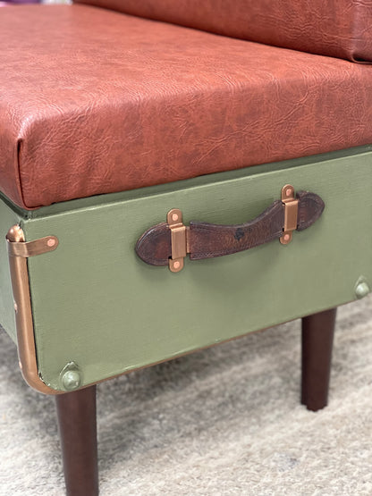 upcycled steamer trunk into a chair with brown leather seat